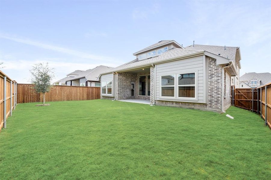 Exterior details and patio area of a home in Creekview Meadows, Pilot Point (Image 21). Exterior details and patio area of a home in Creekview Meadows, Pilot Point (Image 21).