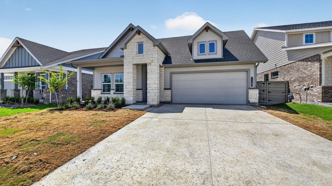 Representative exterior photo of a completed home built from the Desert Willow by D.R. Horton in Treeline, Justin, TX (Image 2).