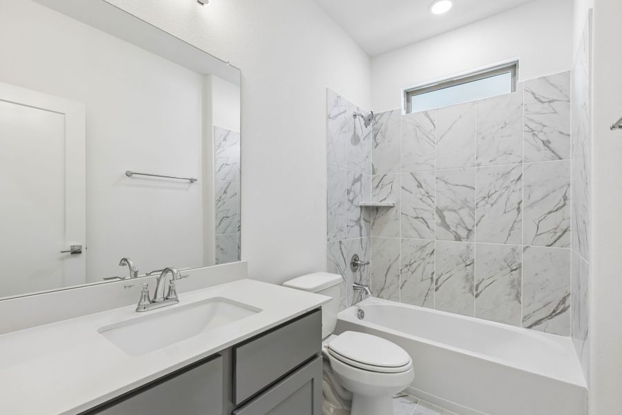 Bathroom in the Claret home plan by Trophy Signature Homes – REPRESENTATIVE PHOTO