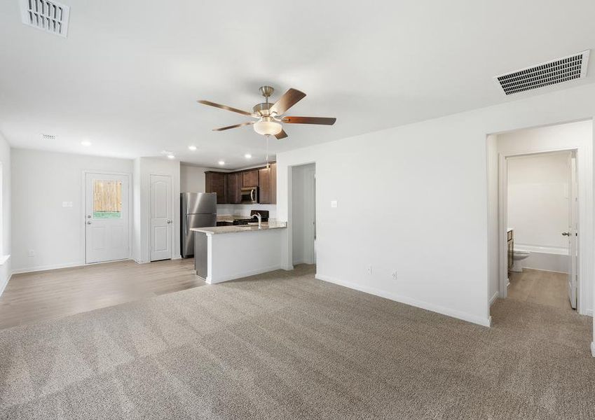 The open layout connects the family room with the kitchen and dining room.