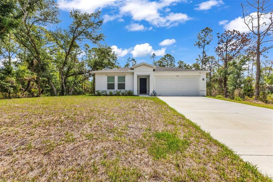 Front exterior of a new home in , Port Charlotte, FL, highlighting curb appeal (Image 19).