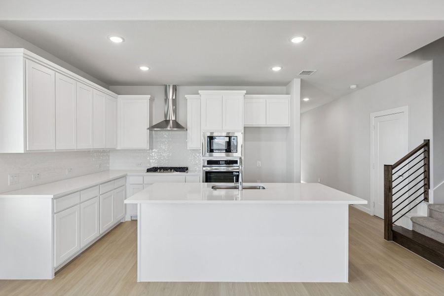 Kitchen in the Stanley II home plan by Trophy Signature Homes – REPRESENTATIVE PHOTO