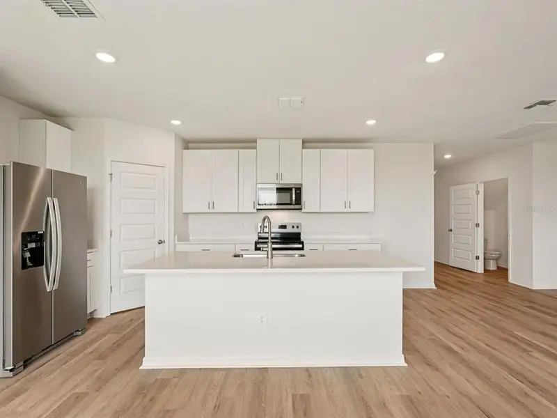 Furnished interior view inside a new home in Two Rivers - Premier Series, Zephyrhills (Image 5). Furnished interior view inside a new home in Two Rivers - Premier Series, Zephyrhills (Image 5).