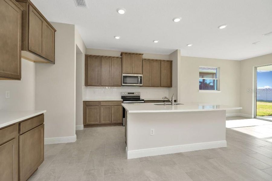 Furnished interior view inside a new home in Mangrove Manor, Apollo Beach (Image 5).