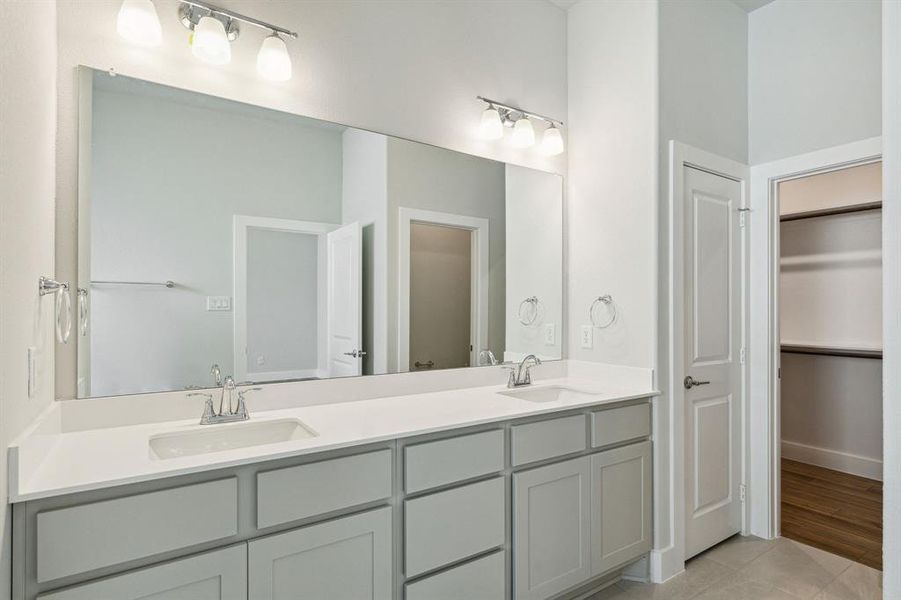 Bathroom with vanity and wood-type flooring