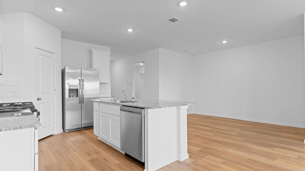 Furnished interior view inside a new home in Caldwell Crossing, Iowa Colony (Image 7).