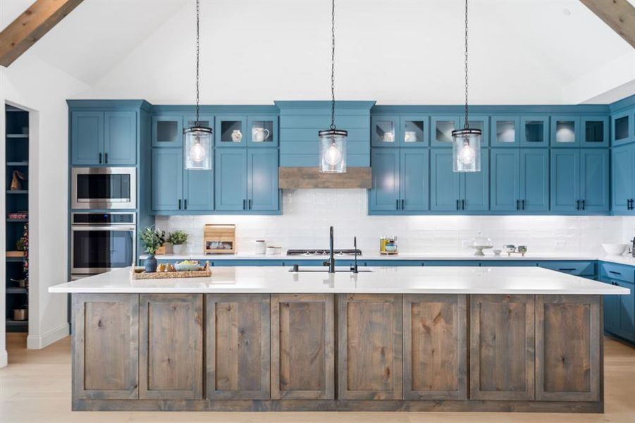 Enjoy exceptional storage with custom, wrap-around cabinetry built seamlessly into both sides of the island.