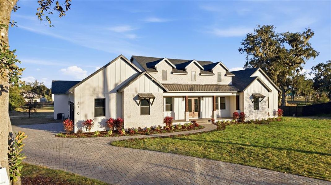 Front exterior of a new home in , Plant City, FL, highlighting curb appeal (Image 32).