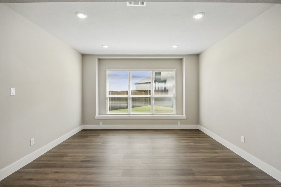 Representative unfurnished interior of a home built from the The Mockingbird by Lillian Custom Homes in Polo Ridge, Forney (Image 21).