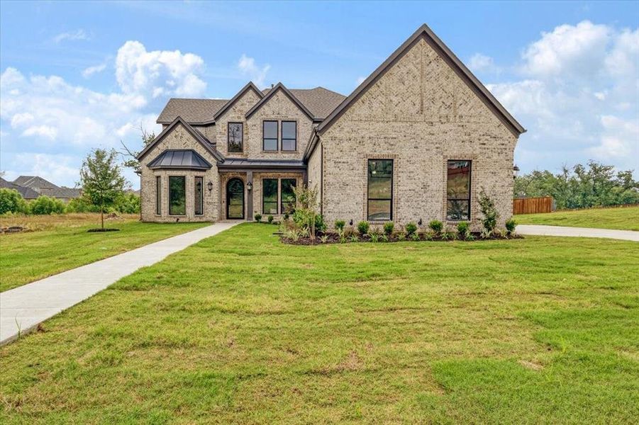 View of front of home with a front lawn