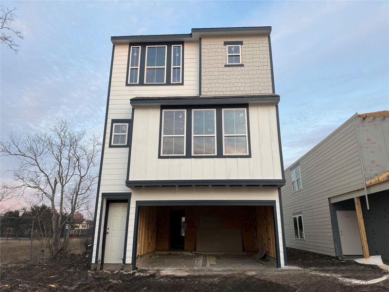 Three story home with 4 beds, 3.5 baths, and 2 car garage