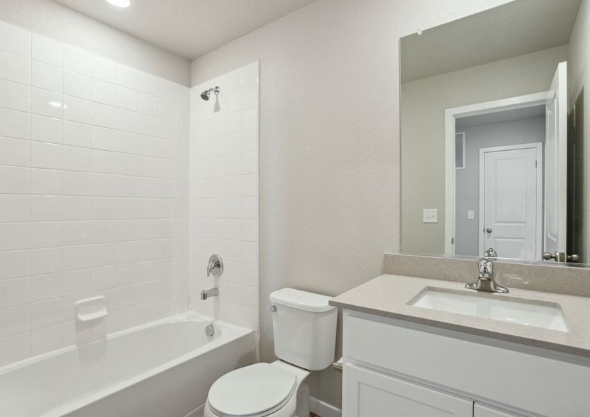 The secondary bathroom has a tub/shower combo.