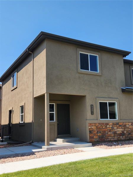 Front exterior of a new home in , Colorado Springs, CO, highlighting curb appeal (Image 2).