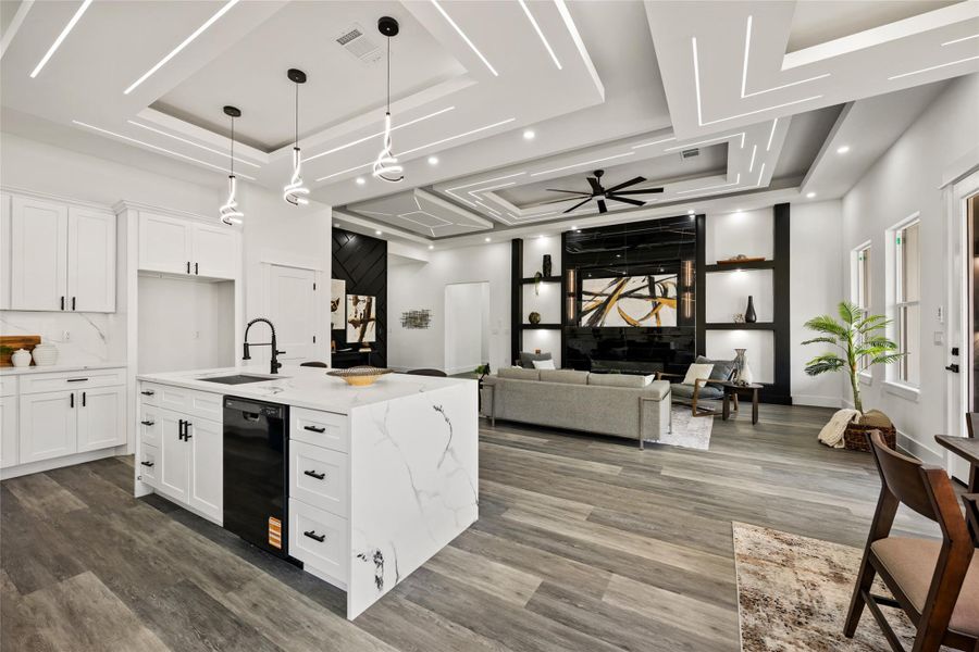 Open-concept living space featuring wood-finish flooring