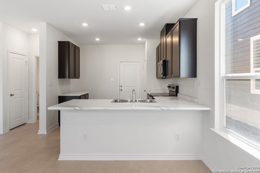 Furnished interior view inside a new home in Spanish Trails Villas, San Antonio (Image 6).