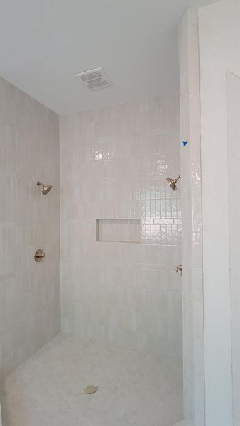 Shower with two spray heads.