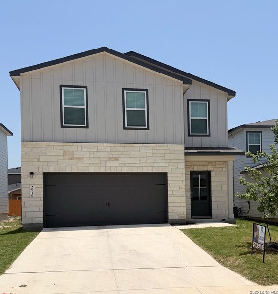 Front exterior of a new home in Applewhite Meadows, San Antonio, TX, highlighting curb appeal (Image 1). Front exterior of a new home in Applewhite Meadows, San Antonio, TX, highlighting curb appeal (Image 1).