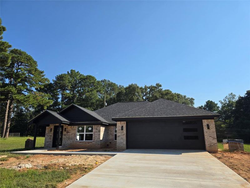 Front exterior of a new home in , Daingerfield, TX, highlighting curb appeal (Image 5).
