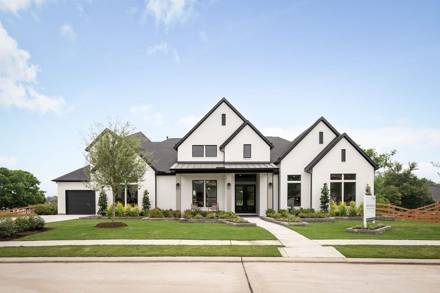 Representative exterior photo of a completed home built from the Meritage by Tri Pointe Homes in Legacy Grove, Montgomery, TX (Image 25).