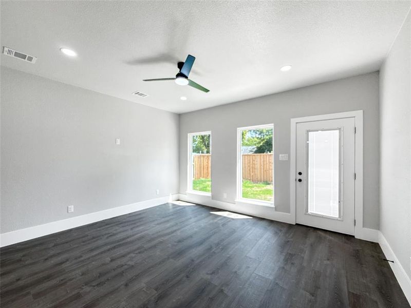 Unfurnished room with dark wood-style floors, recessed lighting, a ceiling fan, and a textured ceiling
