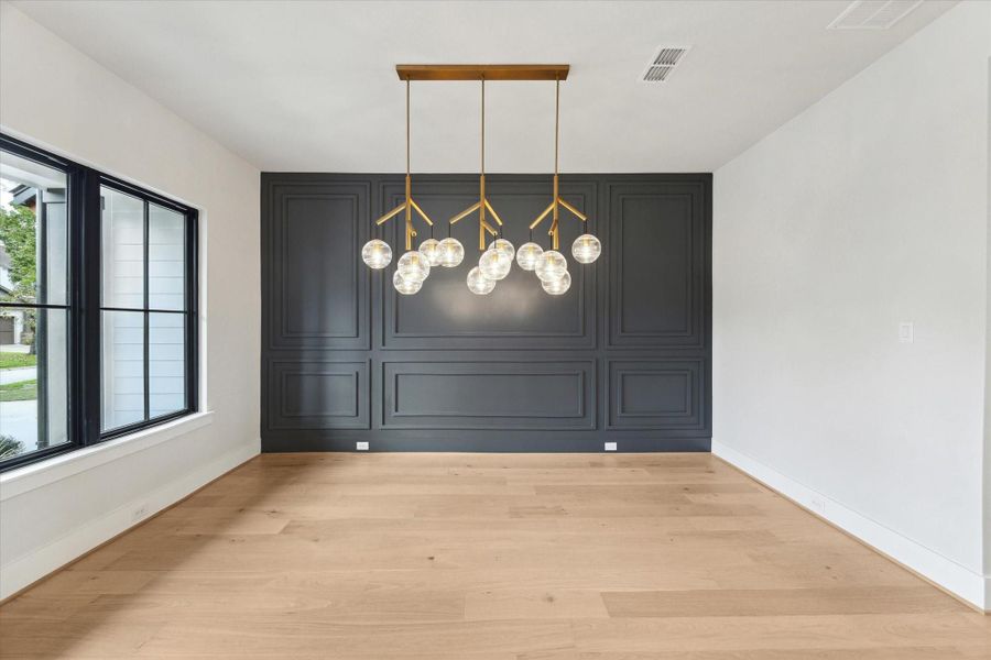 Enjoy dining with this stunning chandelier and accent wall! Enjoy dining with this stunning chandelier and accent wall!