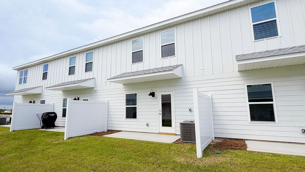 Exterior details and patio area of a home in Salt Creek Townhomes at Mexico Beach, Mexico Beach (Image 20).