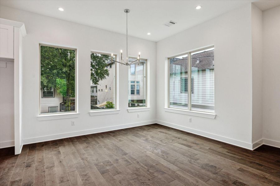 Formal Dining Room * Surrounded by Windows * Modern Fixtures.