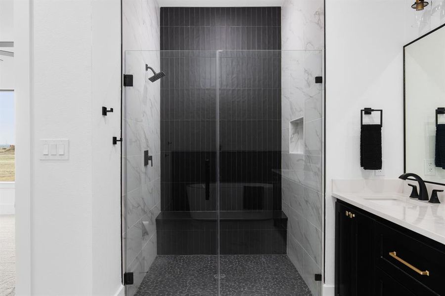 Bathroom with vanity and an enclosed shower