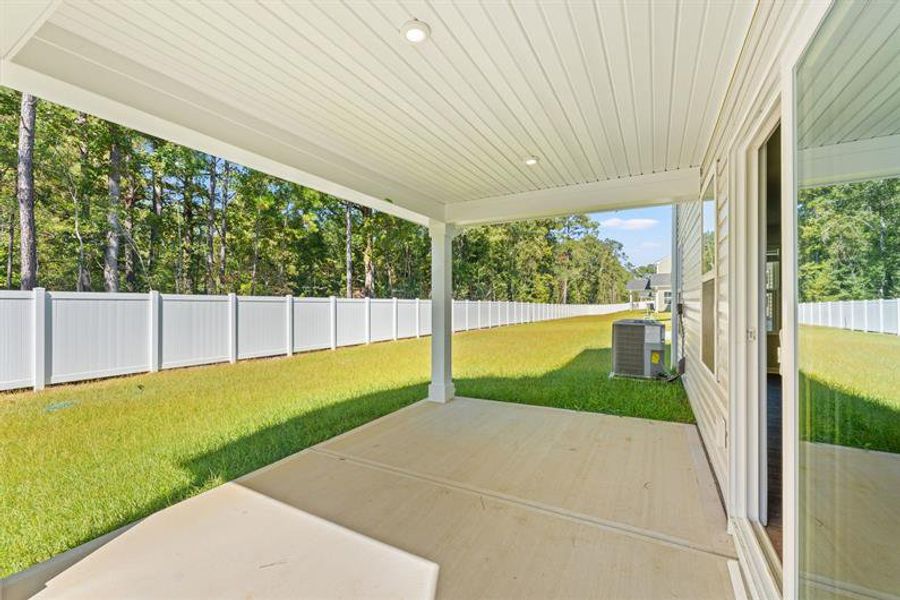 Exterior details and patio area of a home in Bell Creek Single Family Homes, Winnabow (Image 2).