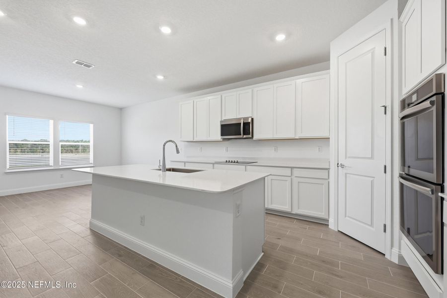 Furnished interior view inside a new home in Edenbrooke at Hyland Trail | 55+: Edenbrooke at Hyland Trail 60s, Green Cove Springs (Image 8). Furnished interior view inside a new home in Edenbrooke at Hyland Trail | 55+: Edenbrooke at Hyland Trail 60s, Green Cove Springs (Image 8).