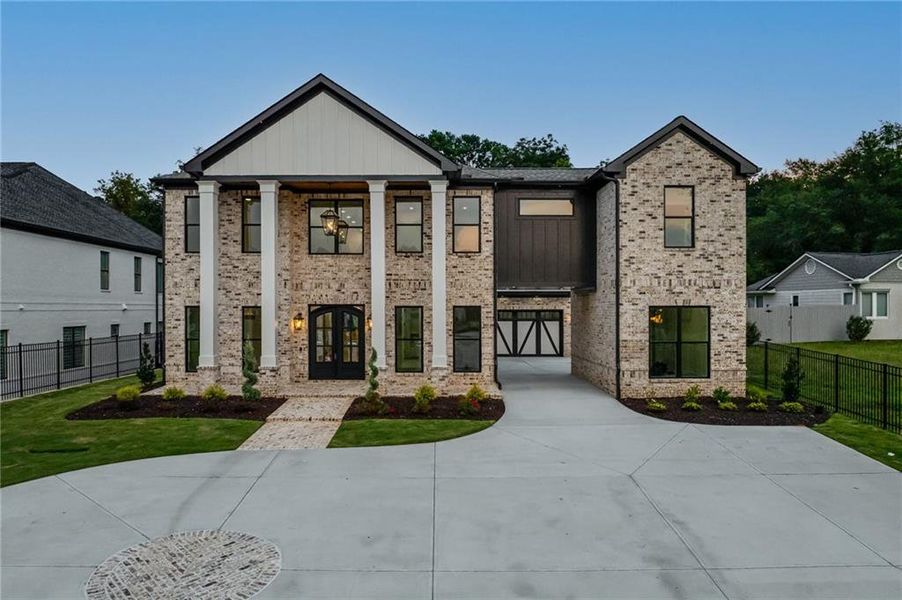 Front exterior of a new home in , Buford, GA, highlighting curb appeal (Image 31). Front exterior of a new home in , Buford, GA, highlighting curb appeal (Image 31).