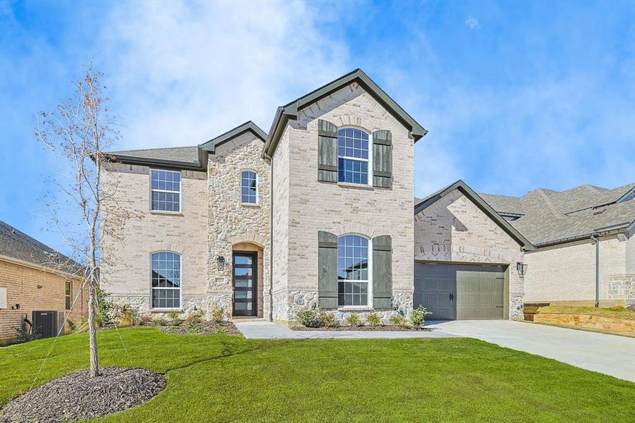Front exterior of a new home in , Argyle, TX, highlighting curb appeal (Image 1).