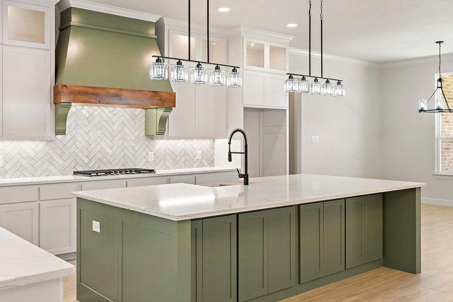 Kitchen featuring green cabinetry, white cabinetry, a kitchen island with sink, tasteful backsplash, and glass insert cabinets