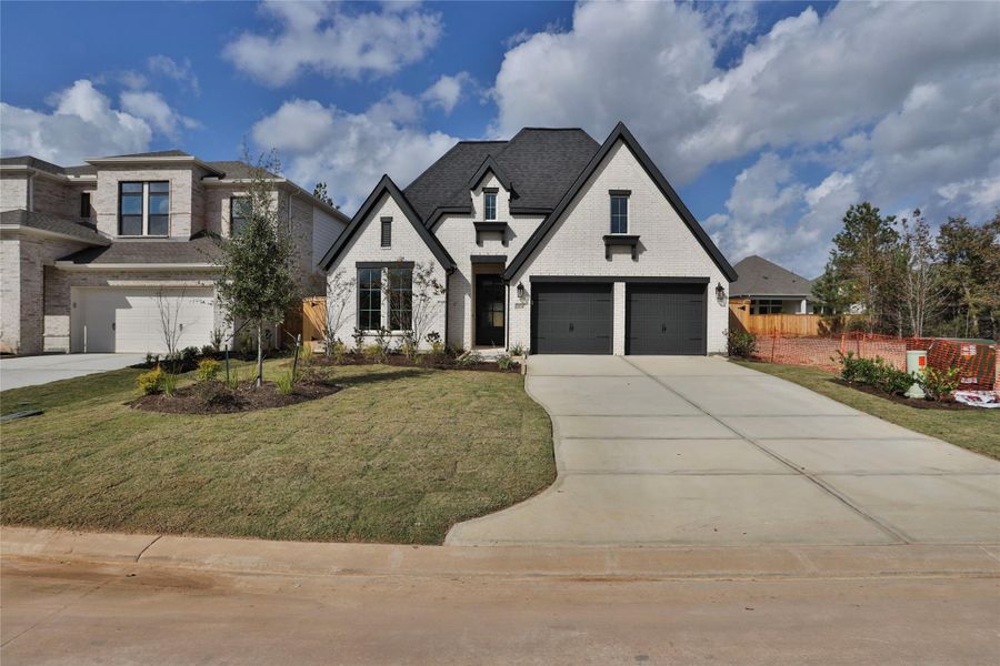 Front exterior of a new home in Kresston 50', Montgomery, TX, highlighting curb appeal (Image 1). Front exterior of a new home in Kresston 50', Montgomery, TX, highlighting curb appeal (Image 1).