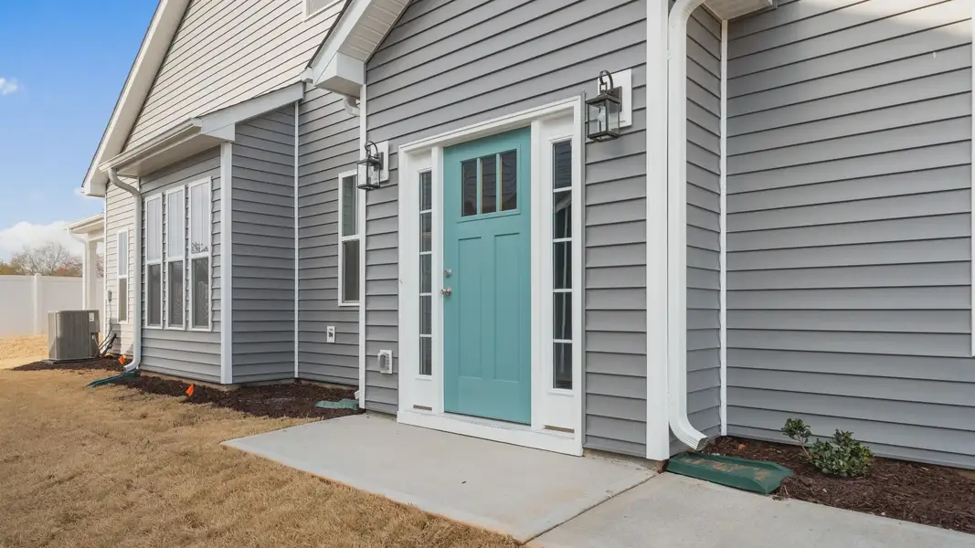 Side Door Front Entry of The Lakehurst Design by DRB Homes