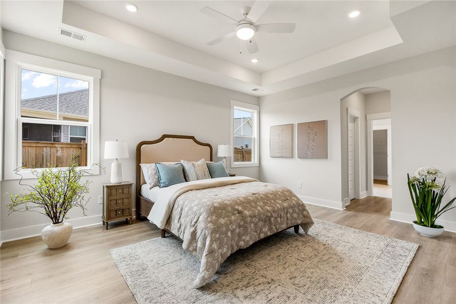 Recessed lighting and a ceiling fan adorn the tray Recessed lighting and a ceiling fan adorn the tray