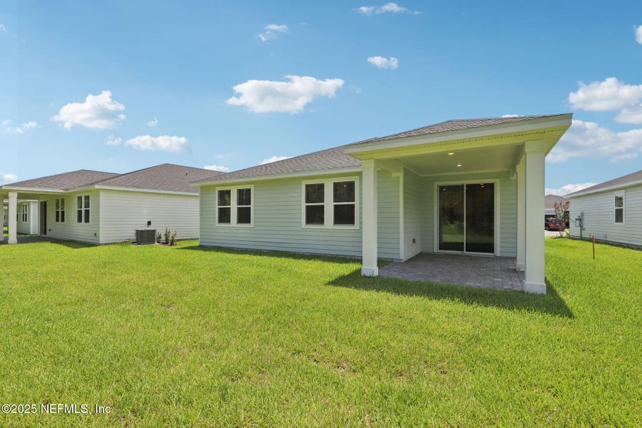 Front exterior of a new home in Colbert Landings, Palm Coast, FL, highlighting curb appeal (Image 2).