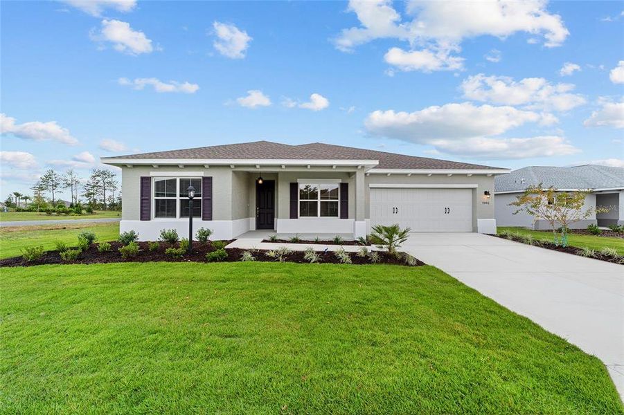 Front exterior of a new home in On Top of the World Communities, Ocala, FL, highlighting curb appeal (Image 2). Front exterior of a new home in On Top of the World Communities, Ocala, FL, highlighting curb appeal (Image 2).
