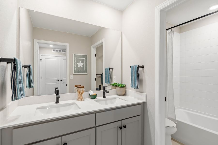 Representative furnished interior of a home built from the 2403 by Risewell Homes in Harvest Crossing, Aurora (Image 24).