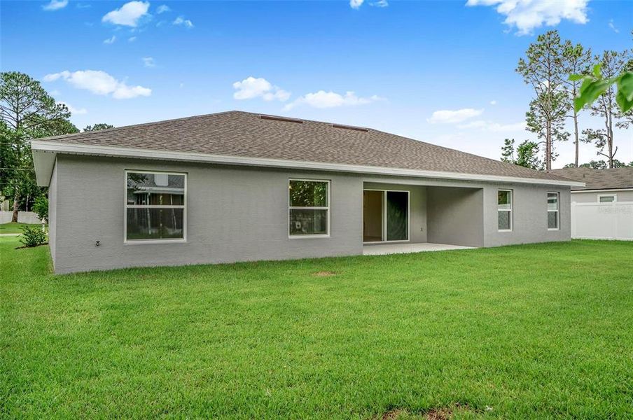Front exterior of a new home in , Palm Coast, FL, highlighting curb appeal (Image 25).