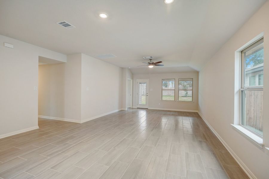 Dining room and living room in the Oleander floorplan at a Meritage Homes community.