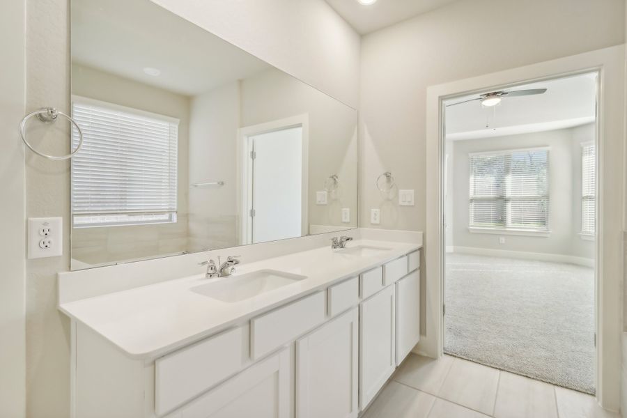 Primary suite bathroom in the Cedar floorplan at a Meritage Homes community.