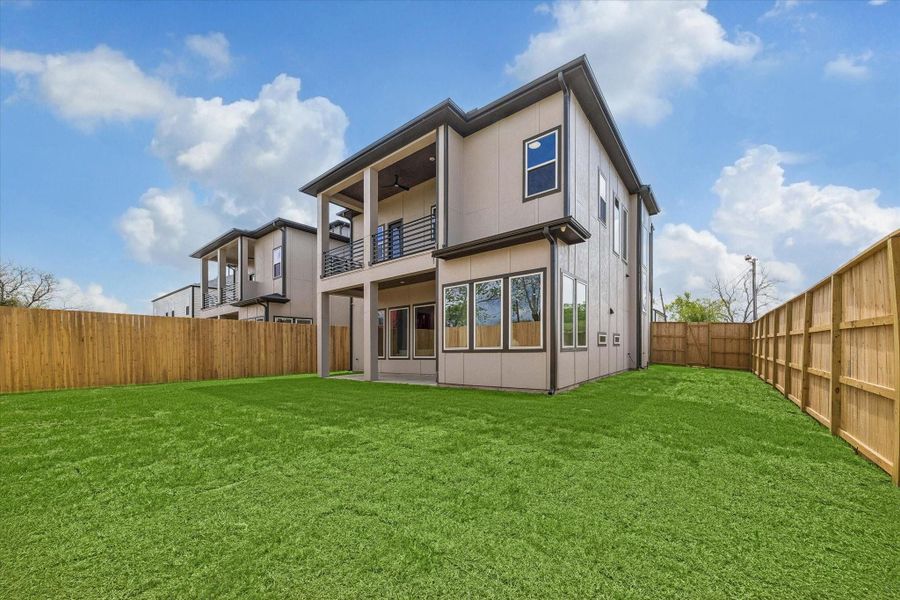 A view of the backyard and second balcony. Two balconies and a roof top deck, WOW!