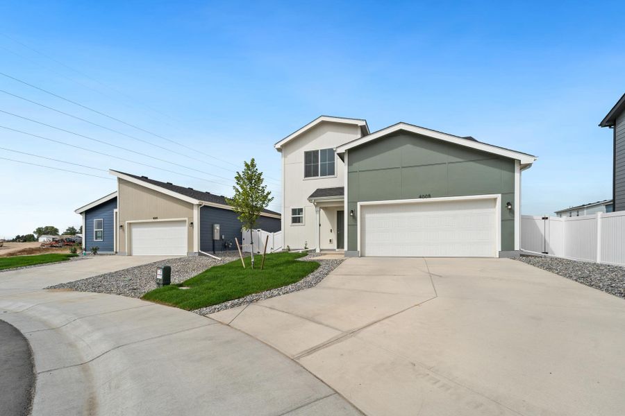 Front exterior of a new home in Liberty Draw, Evans, CO, highlighting curb appeal (Image 27).