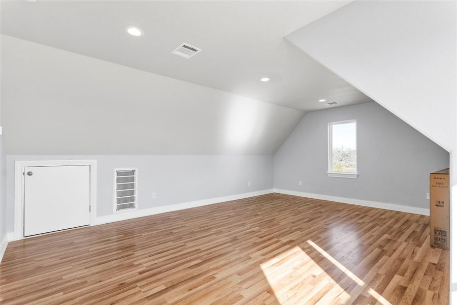 2nd Story 4th Bedroom Suite or Office or Additional living space featuring lofted ceiling, wood flooring, and recessed lighting