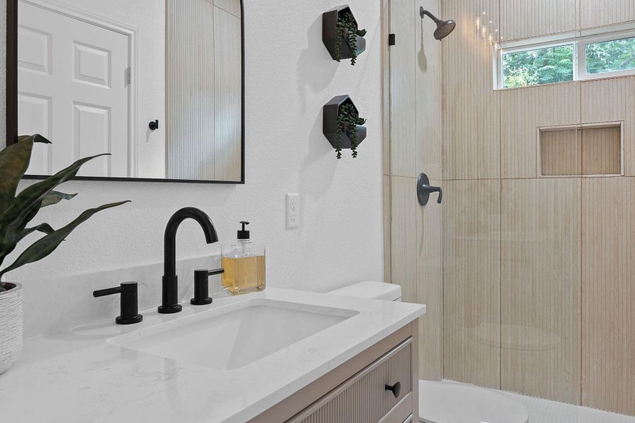 Bathroom with vanity and walk in shower