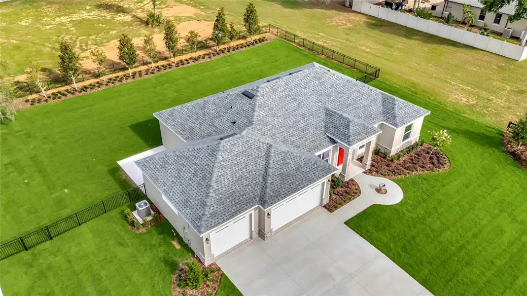 Front exterior of a new home in , Montverde, FL, highlighting curb appeal (Image 19). Front exterior of a new home in , Montverde, FL, highlighting curb appeal (Image 19).