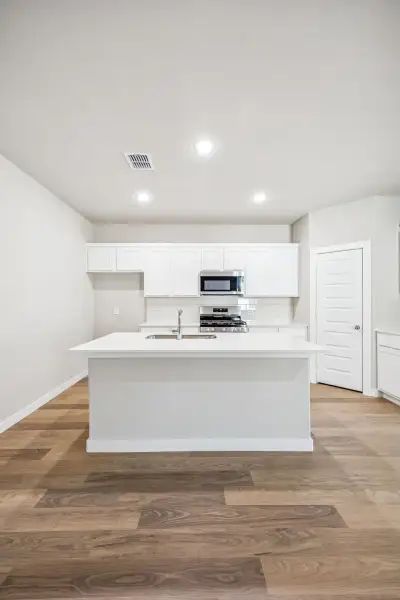 Kitchen in the Willow home plan by Trophy Signature Homes – REPRESENTATIVE PHOTO Kitchen in the Willow home plan by Trophy Signature Homes – REPRESENTATIVE PHOTO