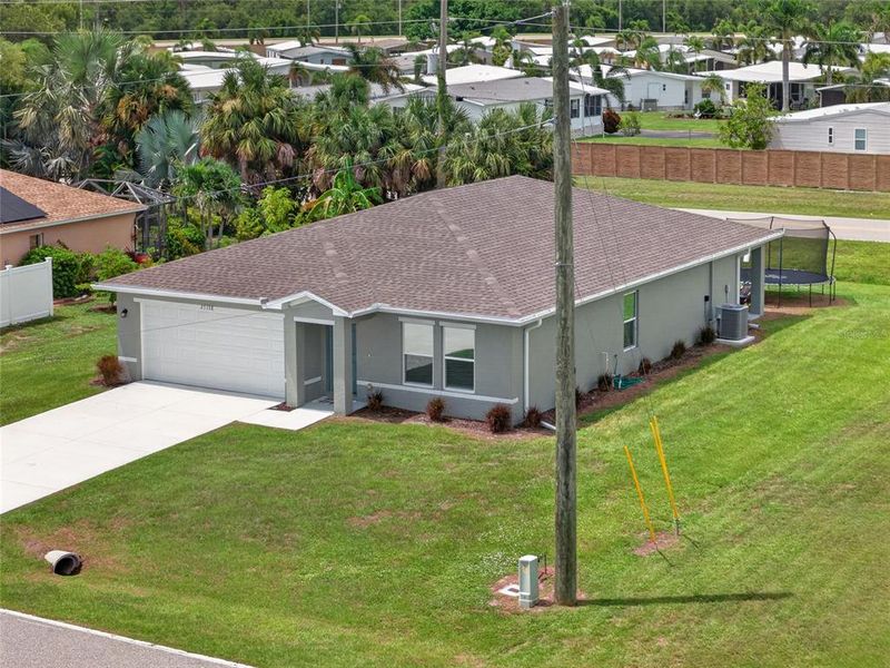 Front exterior of a new home in , Punta Gorda, FL, highlighting curb appeal (Image 28). Front exterior of a new home in , Punta Gorda, FL, highlighting curb appeal (Image 28).