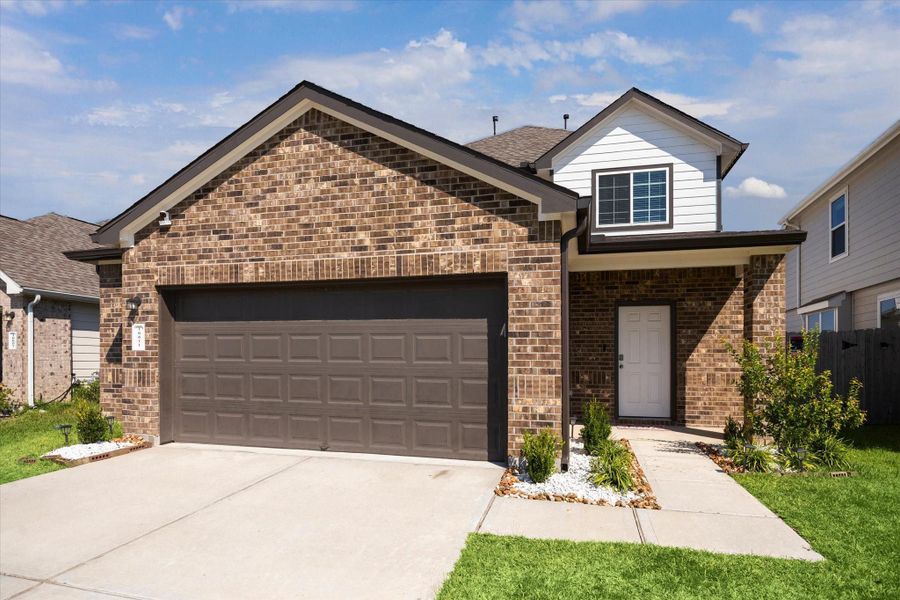 Front exterior of a new home in Granger Pines, Conroe, TX, highlighting curb appeal (Image 1). Front exterior of a new home in Granger Pines, Conroe, TX, highlighting curb appeal (Image 1).